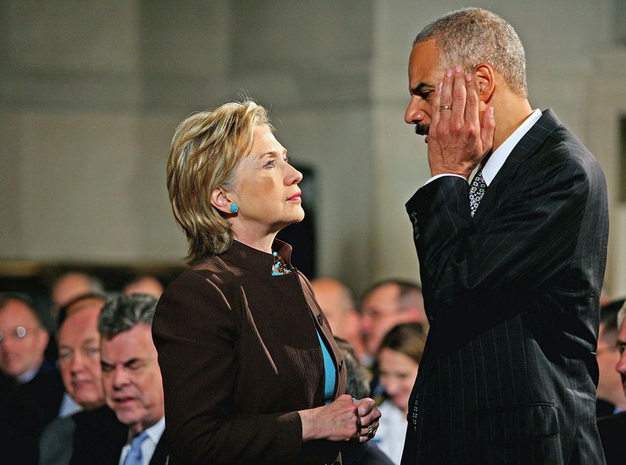Katie Falkenberg/The Washington Times
Secretary of State Hillary Rodham Clinton catches up with Attorney General Eric H. Holder Jr. before Mr. Obama's 50-minute address on national security at the National Archives.