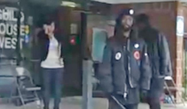 **FILE** Members of New Black Panther Party carrying nightsticks stand outside a Philadelphia polling place. (ElectionJournal.org)
