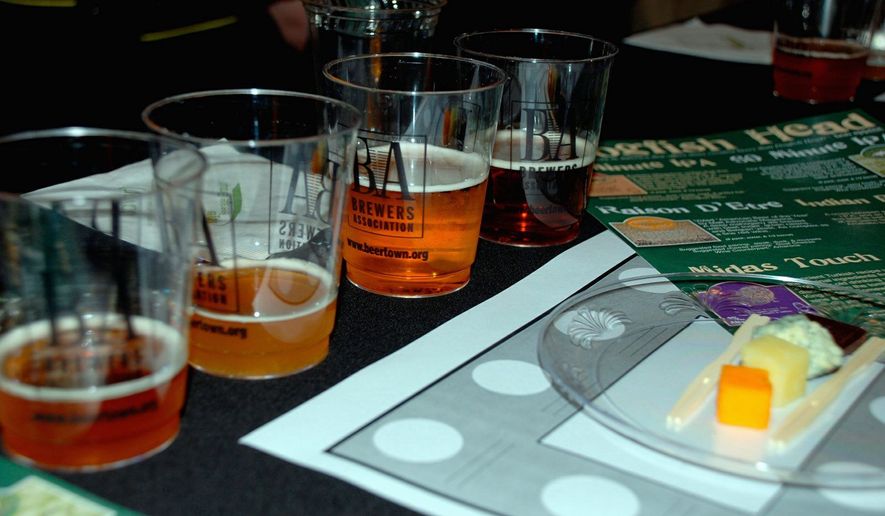 DAVID JOHNSON
Craft beer (top) can be dark and more flavorful than wine, its boosters say. A line forms (below) for admission into Savor, a beer-and-food-pairing festival (above) held Saturday at the National Building Museum.