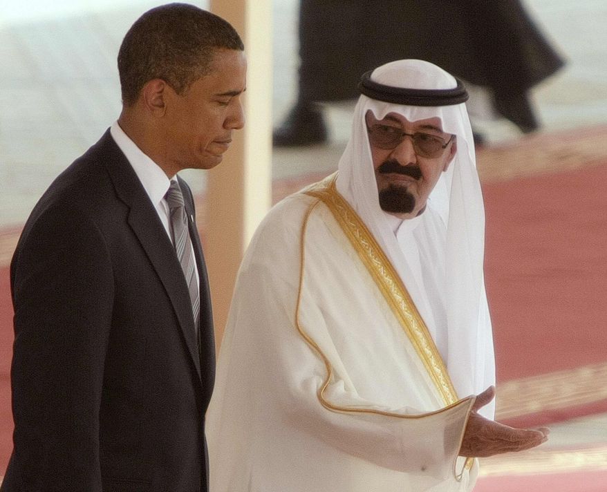 King Abdullah of Saudi Arabia, right, welcomes US President Barack Obama, left, on his arrival at the Royal Terminal of the King Khalid International Airport, in Riyadh, Saudi Arabia, Wednesday, June 3, 2009. (AP Photo/Hassan Ammar)