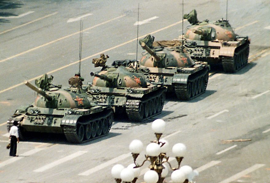 Associated press
A Chinese man stands in front of tanks heading down Cangan Boulevard, past the Beijing Hotel, near Tiananmen Square in Beijing on June 5, 1989. The man was pulled away by bystanders, and the tanks continued.