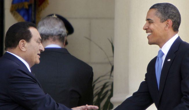 Egyptian President Hosni Mubarak, left, greets U.S. President Barack Obama upon his arrival at Qubba palace in Cairo, Egypt, Thursday, June 4, 2009. President Obama is due to address the Muslim world in a speech during his visit to Egypt. (AP Photo/Amr Nabil)