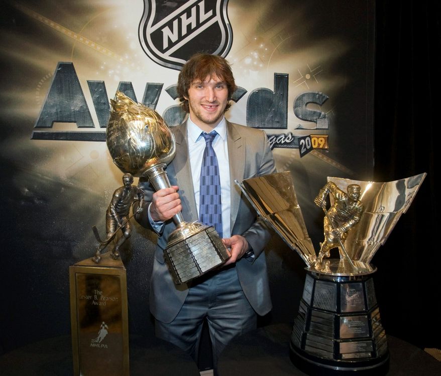 ASSOCIATED PRESS/CANADIAN PRESS
ALEXANDER THE GREAT: Washington Capitals star Alex Ovechkin holds the Hart Memorial Trophy as he poses with the Lester B. Pearson Award (left) and the Maurice Richard Trophy.