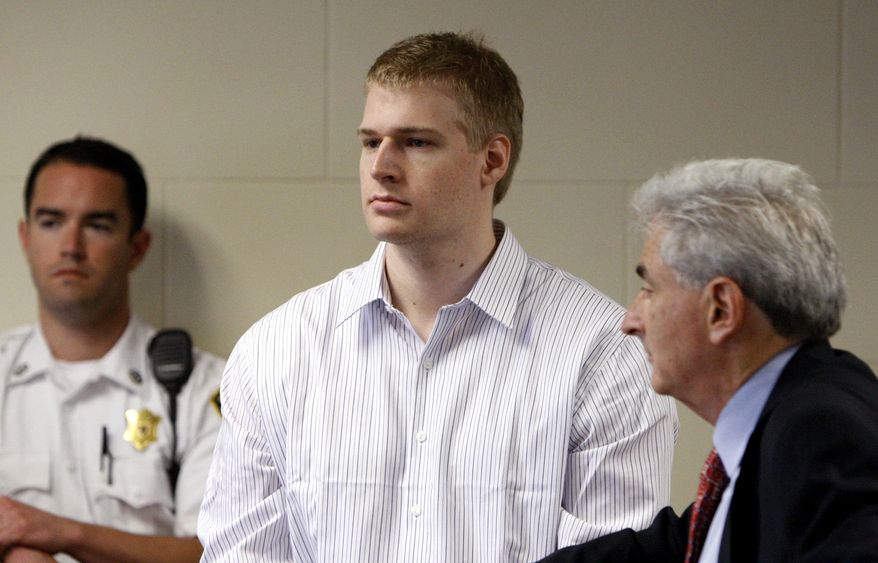 ** FILE ** Former Boston University medical student Philip Markoff (center) stands with his attorney, John Salsberg (right), during his arraignment in Suffolk Superior Court on Monday, June 22, 2009, in Boston. Mr. Markoff was charged with first-degree murder in the fatal shooting of one woman and the gunpoint robbery of another woman in downtown Boston hotels. (AP Photo/Bizuayehu Tesfaye, Pool)