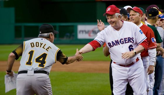 In this file photo from a prior year, coaches Reps. Mike Doyle, Pennsylvania Democrat., and Joe Barton, Texas Republican, shake hands before the game.