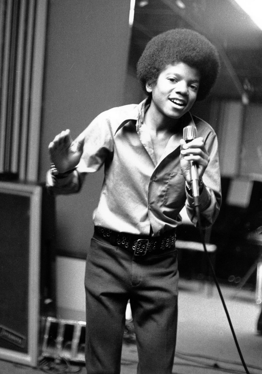 **FILE** In this 1972 file photo, singer Michael Jackson at age 13, the youngest member of the singing group Jackson Five, sings in his home in Encino, Calif. (Associated Press)