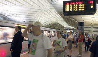 **FILE ** Passengers await a Red Line train at Metro&#39;s Metro Center station in Washington. (AP Photo/Harry Hamburg) **FILE**