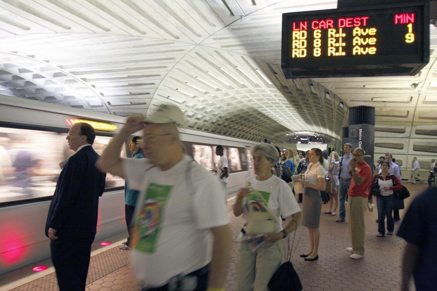 **FILE ** Passengers await a Red Line train at Metro's Metro Center station in Washington. (AP Photo/Harry Hamburg) **FILE**