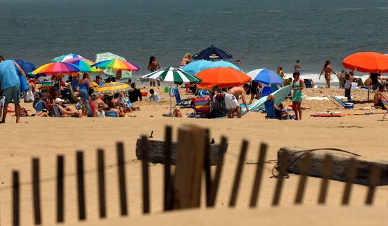 Rod Lamkey Jr./The Washington Times
People begin returning to Ocean City&#39;s beaches for the Fourth of July weekend after a rainy June kept many away.