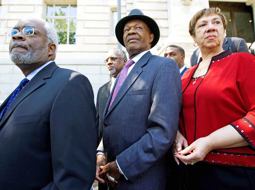 ** FILE ** This 2009 file photo shows D.C. Council member Marion Barry, flanked by his attorney, Frederick D. Cooke Jr., and his then chief of staff, Bernadette Tolson. (Associated Press)