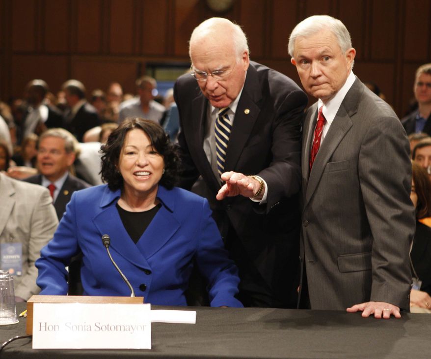 Supreme Court nominee Judge Sonia Sotomayor, accompanied by Senate Judiciary Committee Chairman Sen. Patrick Leahy, D-Vt., center, and the committee's ranking Republican Sen. Jeff Sessions, R-Ala., prepares to testify before the committee, Monday, July 13, 2009, on Capitol Hill in Washington. (AP Photo/Ron Edmonds)