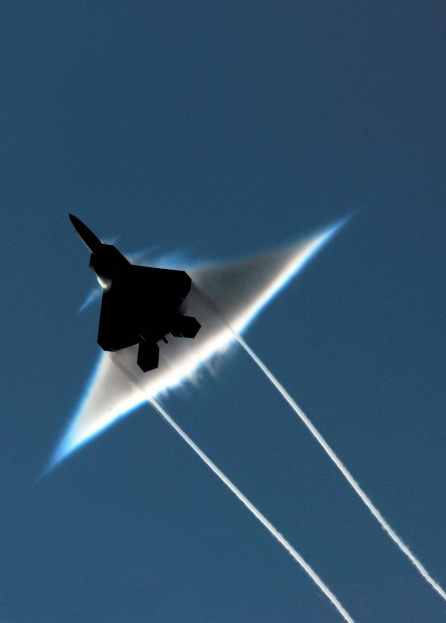 ** FILE ** The F-22 Raptor, one of the world's most sophisticated stealth fighter jets, is at the center of a political battle in which President Obama wants to rein in dysfunctional federal defense-contracting practices. (Associated Press)
