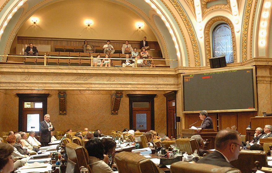 ** FILE ** Mississippi state Reps. Jeffrey C. Smith (left) and Greg Snowden debate a bill regarding budget appropriations for public utilities staff during a special session of the state Legislature on July 10, 2009. (Associated Press)