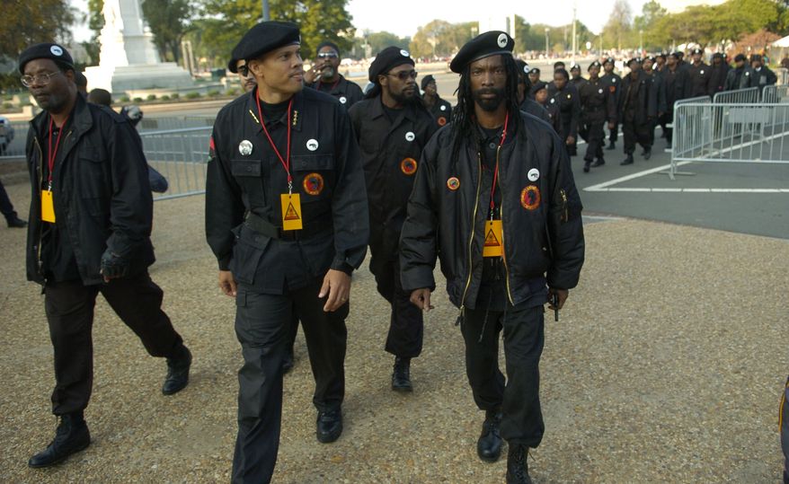 Members of the New Black Panther Party walk toward the U.S. Capitol for the Million More Movement rally to commemorate the 10th anniversary of the Million Man March on Oct. 15, 2005. (J.M. Eddins Jr./The Washington Times) ** FILE **