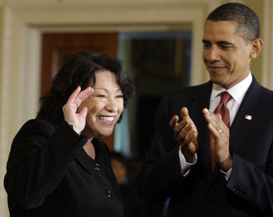 President Barack Obama applauds new Supreme Court Justice Sonia Sotomayor at the start of a reception in the East Room of The White House in Washington, Wednesday, Aug. 12, 2009. (AP Photo/Alex Brandon)