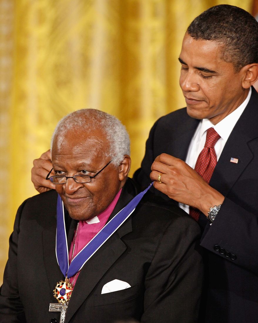 ** FILE ** President Obama presents the Medal of Freedom to retired Archbishop Desmond Tutu, August 12, 2009. (Getty Images)