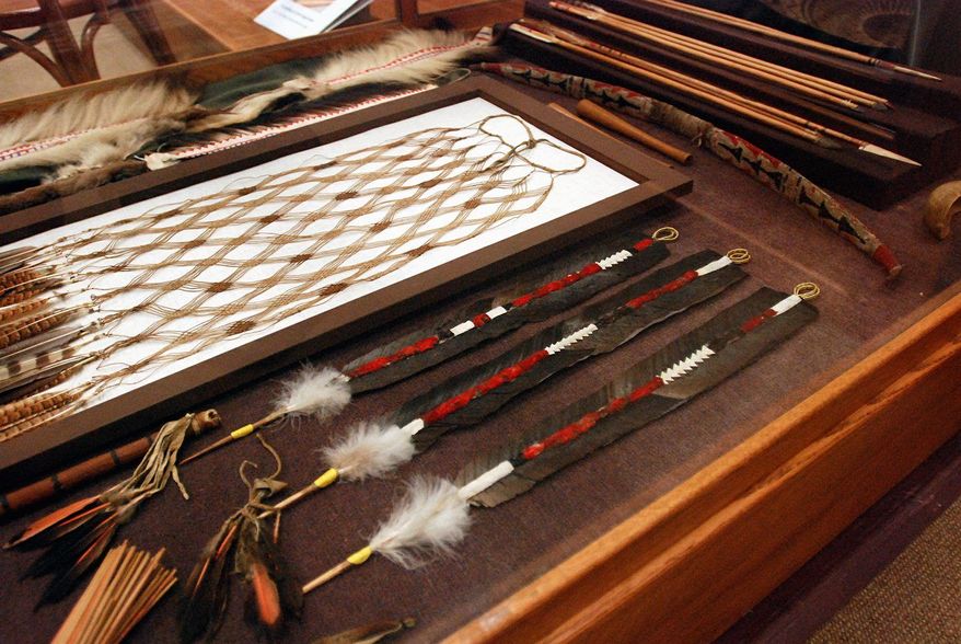 ** FILE ** In this photo taken on Aug. 5, 2009, condor feathers were used to make this White Deerskin Dance regalia used by the Karuk Tribe, displayed at the Clark Historical Museum in Eureka, Calif. The three feather wands at lower right are a composite of several feathers. The neighboring Yurok Tribe, which also used condor feathers in dance regalia, is studying whether condors can be reintroduced in the Klamath River canyon, where they have not soared for a century. (Associated Press)