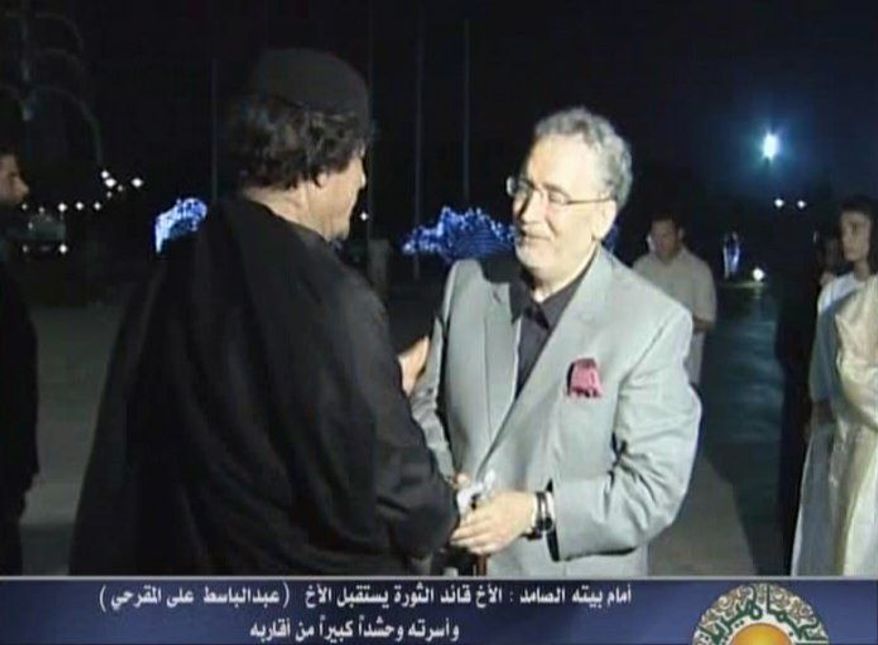 Libyan leader Moammar Gadhafi gives a warm welcome in Tripoli in August 2009 to Abdel Baset al-Megrahi, the only person convicted in the 1988 bombing of Pan Am Flight 103. (Agence France-Presse/Getty Images)