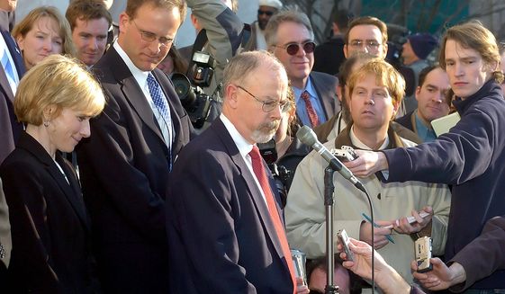 John Durham speaks to reporters in Connecticut in 2005 after the sentencing of former Connecticut Gov. John G. Rowland. Former Clinton campaign lawyer Michael Sussmann asked a federal judge Thursday to dismiss the charges filed against him by special counsel John Durham, who is probing the Justice Department&#39;s actions in the early stages of the Trump-Russia collusion probe. (Associated Press/FILE)
