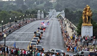 The motorcade of Senator Edward Kennedy crosses Memorial Bridge on route to Arlington National Cemetery where a burial service is held for the late Senator in Washington, D.C., Saturday, August 29, 2009. (Astrid Riecken/The Washington Times)