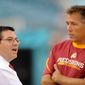 Head coach of the Washington Redskins Jim Zorn (right) speaks with owner Daniel Snyder before the Redskins play the Jacksonville Jaguars. (Michael Connor / The Washington Times)