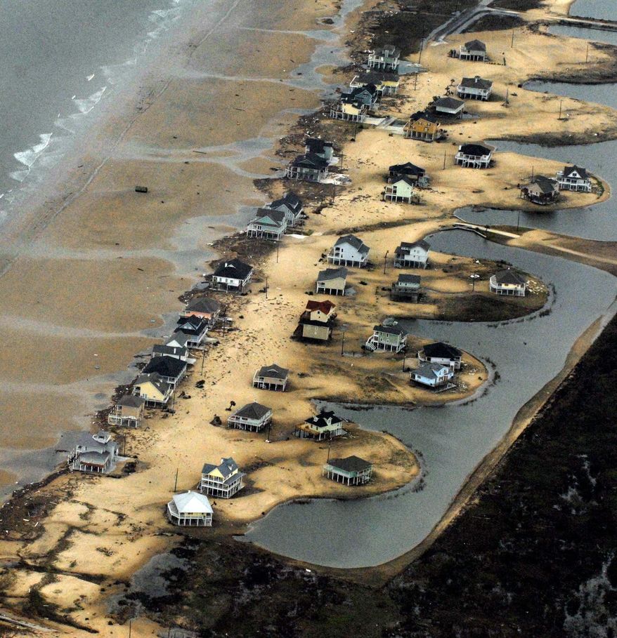 Homes along the waterfront near Galveston, Texas, are severely damaged a day after Hurricane Ike made landfall. (Rod Lamkey Jr./The Washington Times)