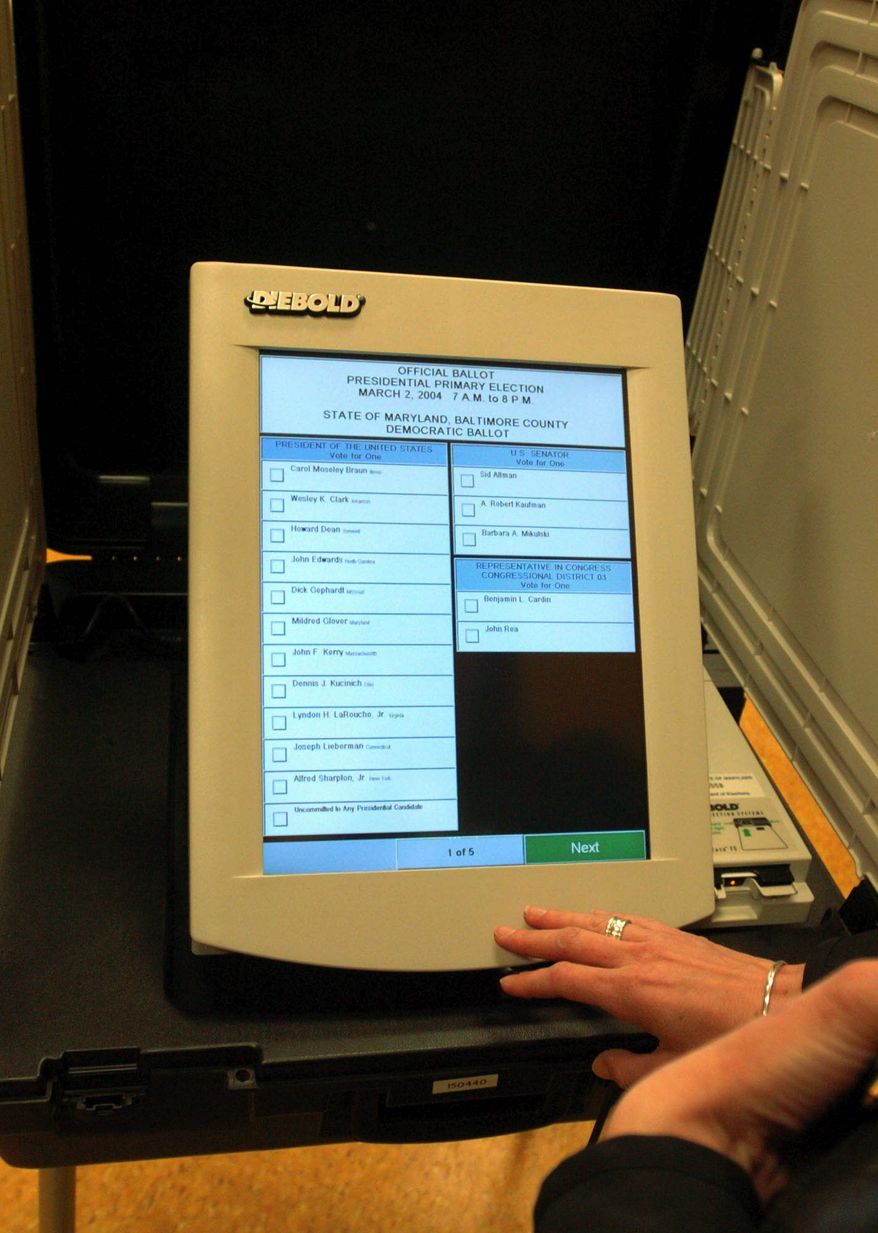 The pending merger of electronic voting machine companies has triggered concerns that voter fraud will increase if one company has too much control. (Associated Press)