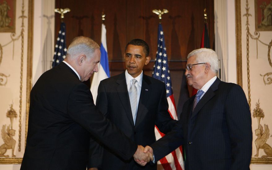 President Obama meets with Israeli Prime Minister Benjamin Netanyahu (left) and Palestinian President Mahmoud Abbas in New York on Tuesday, Sept. 22, 2009, on the sidelines of the U.N. General Assembly meeting. (AP Photo/Charles Dharapak)