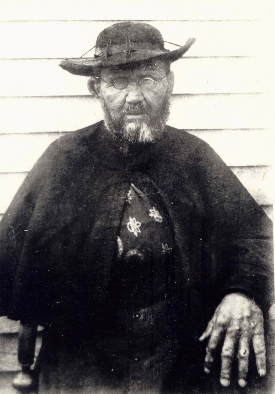 File - Father Damien, a Belgian priest who ministered at a leprosy settlement in Kalaupapa, Hawaii, in the 19th century, is seen here two months before he died of the contagious disease in 1889. Patients from the island will be traveling to his canonization at the Vatican this month. (Oct. 1, 2009/Associated Press)