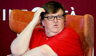 U.S. filmmaker Michael Moore attends a meeting at the 66th edition of the Venice Film Festival in Venice, Italy, in this Saturday, Sept. 5, 2009, file photo. (AP Photo/Domenico Stinellis) ** FILE **