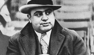 ASSOCIATED PRESS
Chicago mobster Al Capone, shown here at a football game in 1931, had a Wisconsin hide-out during Prohibition, and it has sold at auction to a bank for $2.6 million.
