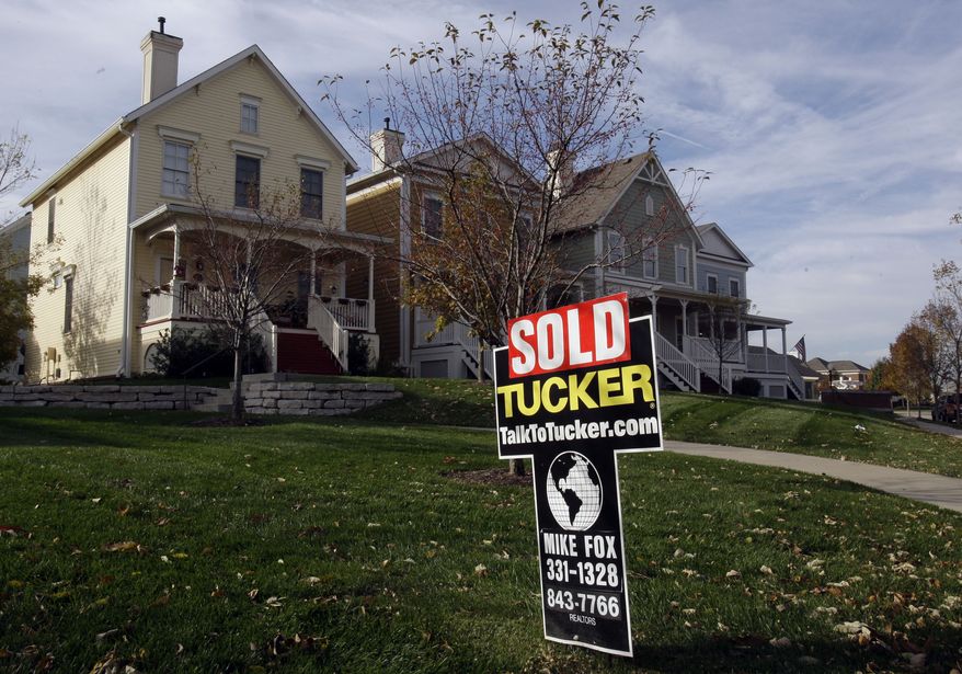 **FILE** A "sold" sign is shown in front of an Indiana home. (AP Photo/Michael Conroy/File)