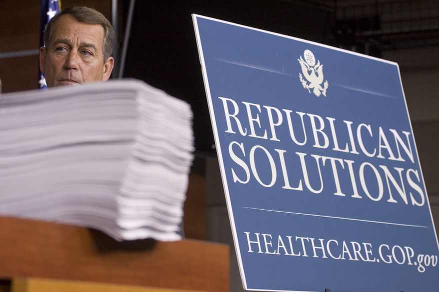 FILE - In this Oct. 29, 2009 file photo House Minority Leader John Boehner of Ohio stands behind a copy of the Democrat's version of the health care bill during a news conference on Capitol Hill in Washington. Boehner, in his Saturday Oct. 31, 2009, radio and Internet address, argues that the Democrats' proposal to overhaul health care is too complicated, too intrusive and too expensive, and Republicans are urging several steps they claim would bring down costs while not greatly expanding government. (AP Photo/Harry Hamburg, File)