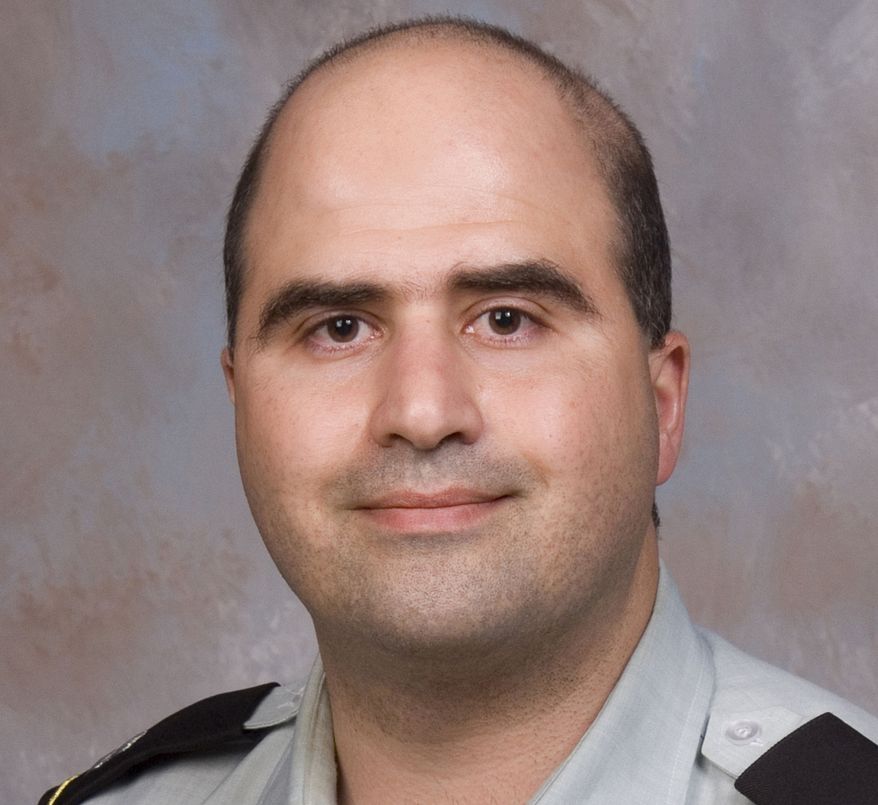 The 2007 picture provided by the Uniformed Services University of the Health Sciences shows Nidal Malik Hasan when he entered the program for his Disaster and Military Psychiatry Fellowship. Authorities said he went on the killing spree at Fort Hood, Texas, which left 13 people dead. (Associated Press/Uniformed Services University of the Health Sciences)