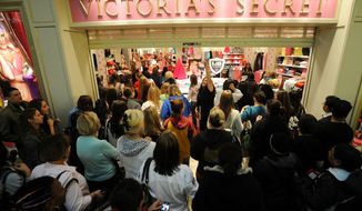  ** File ** Shoppers flood into Victoria&#39;s Secret as it opens on Black Friday, 2012. (Peter Lockley / The Washington Times)

