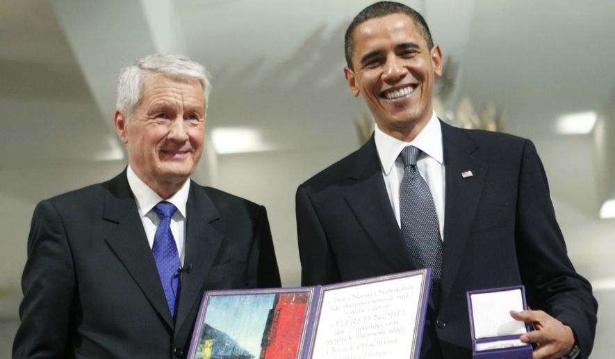 US President and Nobel Peace Prize laureate Barack Obama, right recieves his medal and diploma from the the Chairman of the Nobel committee Thorbjorn Jagland, left at the Nobel Peace Prize ceremony at City Hall in Oslo, Thursday, Dec. 10, 2009. (AP Photo Bjorn Sigurdson/ Scanpix Norway, Pool) 