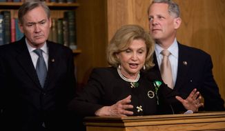 **FILE** Democratic Reps. Carolyn Maloney (center), of New York, Dennis Moore, (left) of Kansas, and Steve Israel, of New York, speak during a March 17, 2009, news conference on Capitol Hill in Washington to discuss AIG. (Associated Press)