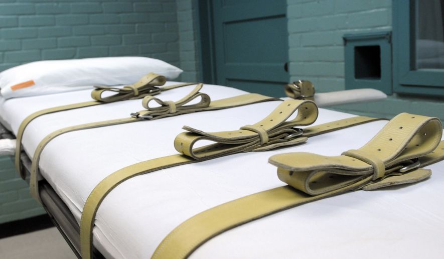 In this Tuesday, May 27, 2008 file photo, the gurney used to restrain condemned prisoners during the lethal injection process is shown in the Texas death house in Huntsville, Texas. Texas and other states that lead America in executions are sentencing many fewer inmates to death, a trend that slowly is reducing the death row population in the United States, a report from an anti-capital punishment group says. (AP Photo/Pat Sullivan, File)