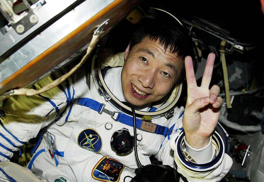 China&#x27;s first astronaut, Yang Liwei, was jubilant after the capsule door was opened after his 21-hour space flight in October 2003. China could put someone on the moon within a decade.