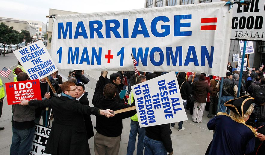 Demonstrators for and against same-sex marriage protest during a rally in front of a federal courthouse in San Francisco, Monday, Jan. 11, 2010. The first federal trial to determine if the U.S. Constitution prohibits states from outlawing same-sex marriage gets under way in San Francisco on Monday, and the two gay couples on whose behalf the case was brought will be among the first witnesses. (AP Photo/Paul Sakuma)