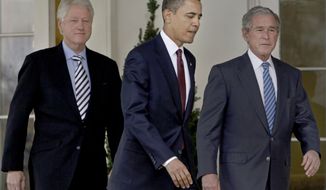 President Obama (center) walks out of the Oval Office of the White House with former Presidents Bill Clinton (left) and George W. Bush to deliver remarks in the Rose Garden in Washington on Saturday, Jan. 16, 2010. Mr. Obama asked the former presidents to help with U.S. relief efforts in Haiti after the earthquake. (AP Photo/Pablo Martinez Monsivais)