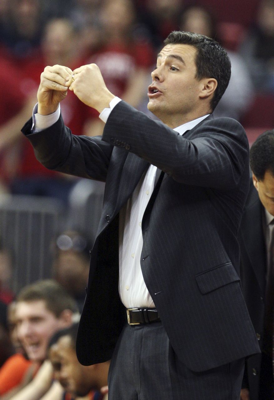ASSOCIATED PRESS Virginia coach Tony Bennett gives his team instructions against North Carolina State during the second half of an NCAA college basketball game Saturday, Jan. 9, 2010, at the RBC Center in Raleigh, N.C. Virginia won 70-62.