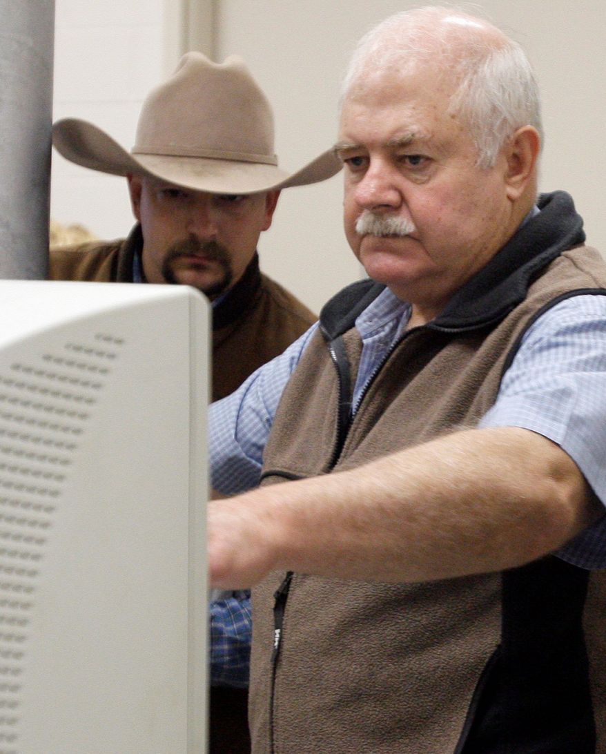 Mr. Wilson-Maki (left) studies a sonogram of a horse's leg with Dr. Kent Carter, chief of medicine at Texas A&M's Large Animal Hospital.