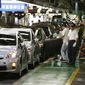 In this June 5, 2009, photo, workers give the final checkup to new Prius hybrid vehicles at Toyota&#x27;s Tsutsumi Plant in Toyota, Japan. (AP Photo/Shizuo Kambayashi, File)
