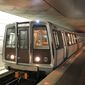 A Red Line train passes through the Farragut North Metro station in Washington. (Associated Press) ** FILE **