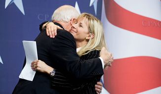 ** FILE ** Former Vice President Dick Cheney hugs his daughter Liz Cheney after she surprised the Conservative Political Action Conference (CPAC) by bringing him as her guest, on Thursday, Feb. 18, 2010, in Washington. (AP Photo/Cliff Owen)