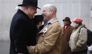 Phillip Dunham (left) of Washington and his partner, Allen Pittinger, who have been together for nine years, embrace after arriving at D.C. Superior Court in Washington to obtain a marriage license on Wednesday, March 3, 2010, the day gay marriage became legal in the District of Columbia. &quot;Exciting, overjoyed — I think &#39;phenomenal&#39; is the word,&quot; Mr. Pittinger said. (AP Photo/Jacquelyn Martin)