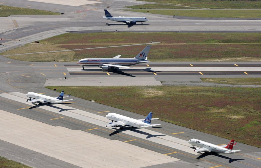 Airplanes taxi at John F. Kennedy International Airport in New York in September 2008. (AP Photo/Mark Lennihan) ** FILE **