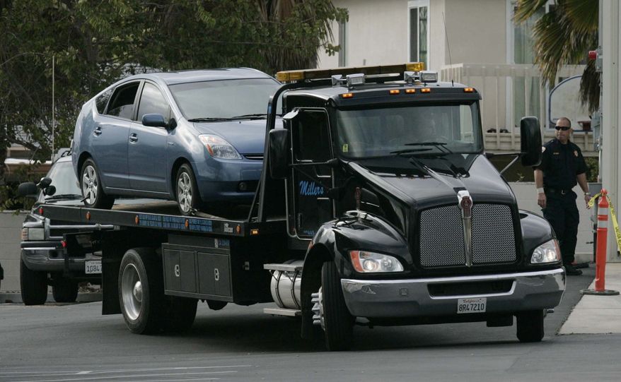 In this March 8, 2010, a California Highway Patrol officer helped slow this runaway Toyota Prius from 94 mph to a safe stop on Monday after the car's accelerator became stuck on a San Diego County freeway, the CHP said. Prius driver James Sikes said that the incident Monday occurred just two weeks after he had taken the vehicle in to an El Cajon dealership for repairs after receiving a recall notice, but he was turned away.(AP Photo/San Diego Union Tribune, John Gibbons)