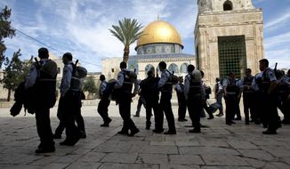 ** FILE ** Israeli police walk through the Al-Aqsa mosque compound, also known to Jews as the Temple Mount, in Jerusalem&#39;s Old City on Wednesday, March 17, 2010. (AP Photo/Tara Todras-Whitehill)